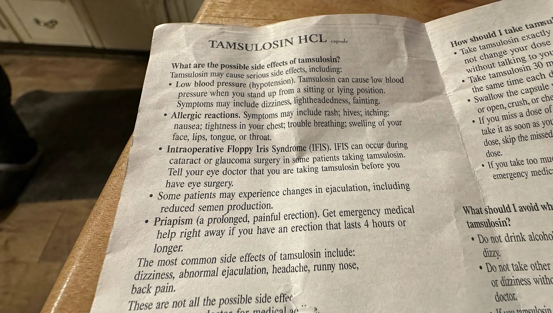 The Tamsulosin pharmacy pamphlet on the kitchen counter. The single line about ejaculation changes visible among the other warnings.